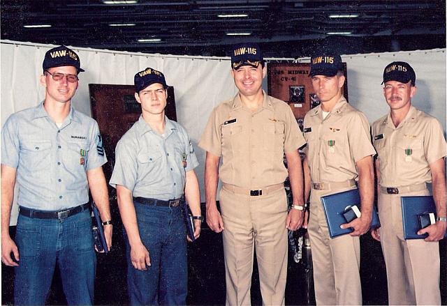 Bernie Burawski, an AMS, CDR Leo F. McGinn (CO),  LT Pete Tomczak (Pilot), & CDR David W. Daugherty (Ops Officer)