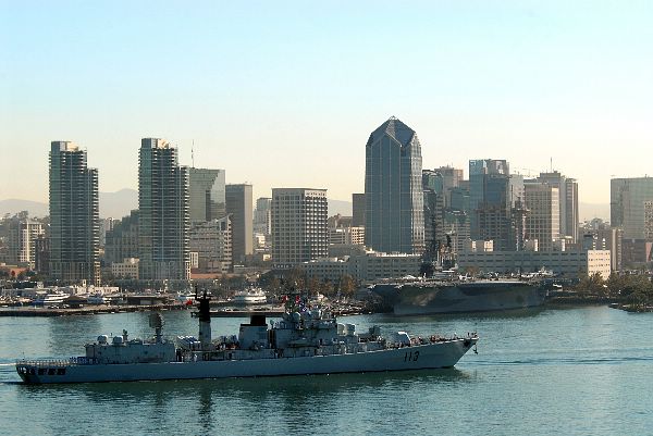 Midway in the background (Sept. 18, 2006) ? The Chinese Navy destroyer Qingdao (DDG 113) transit the San Diego Harbor as it prep